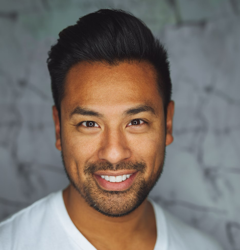Smiling man in white shirt