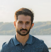 Man in blue polo shirt outdoors